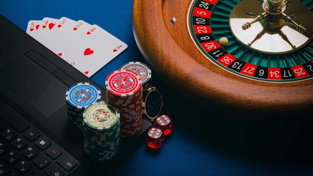 Roulette wheel, dice, chips, and cards in the casino